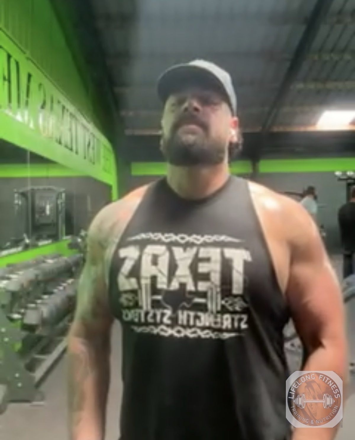 Client wearing Texas Strength Systems tank at the gym