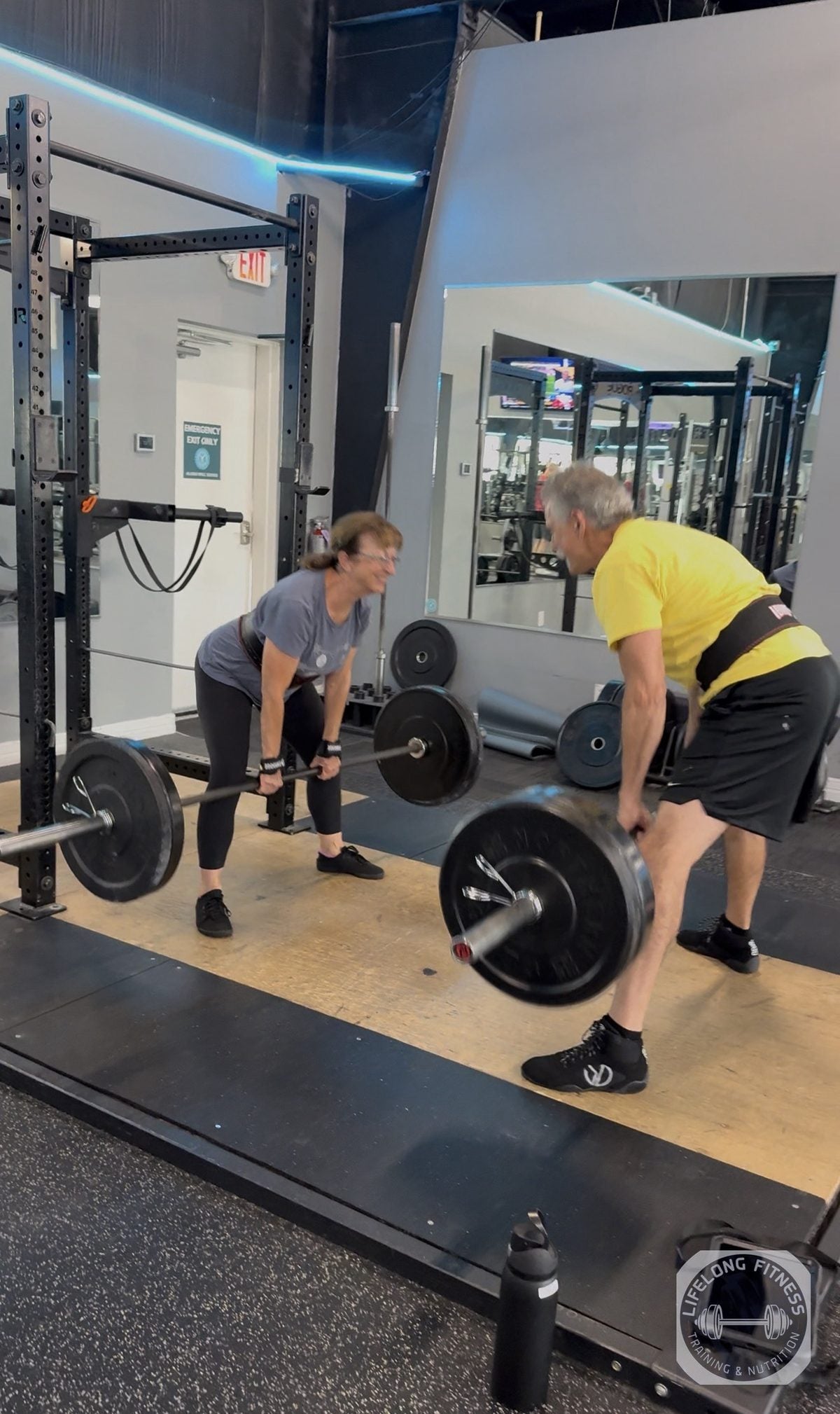 Two clients doing deadlifts at Rise Gym