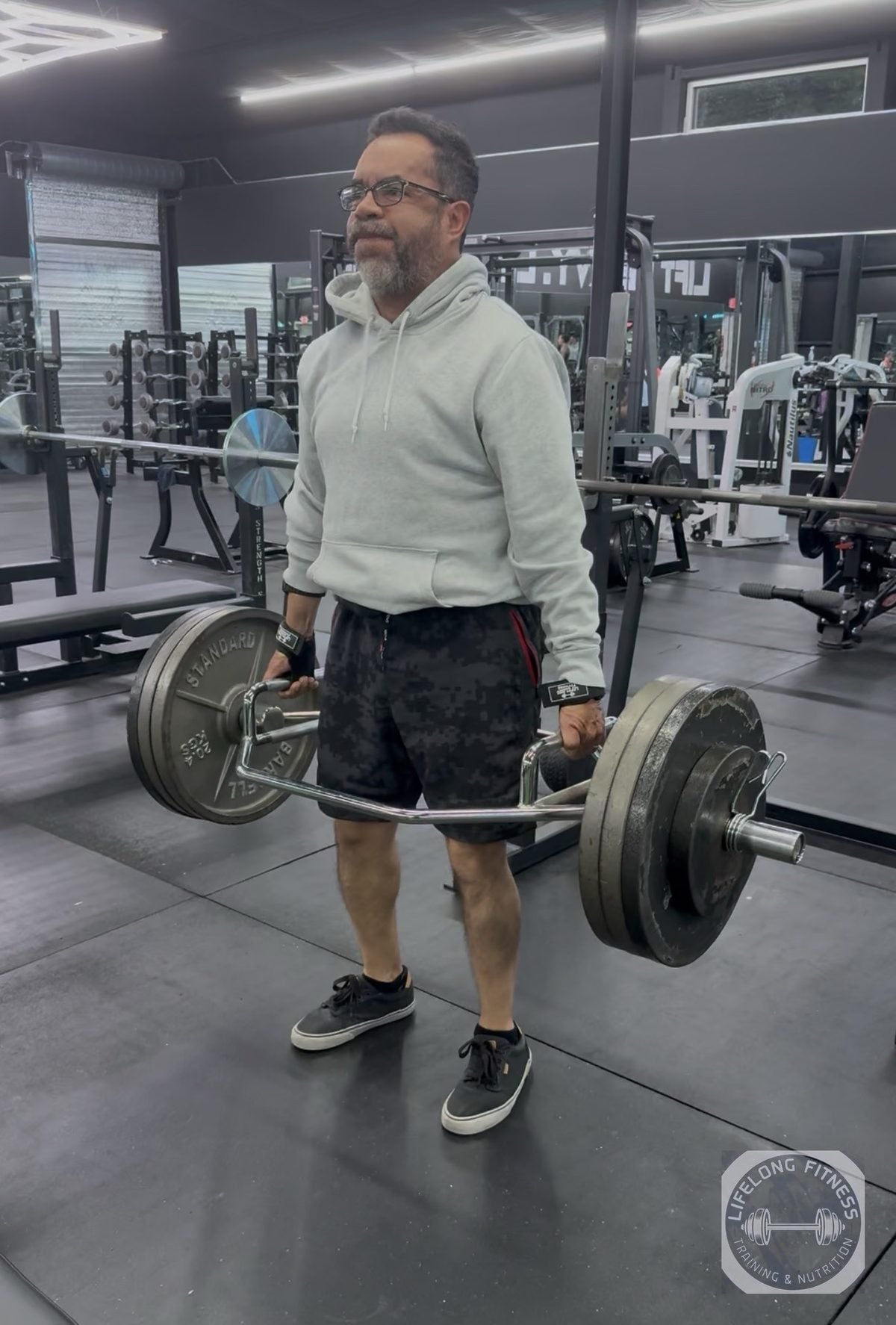 Client performing trap-bar deadlift at Rise Gym
