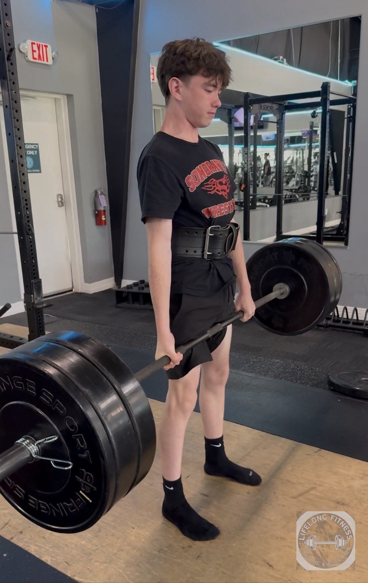 Teen client deadlifting at Rise Gym