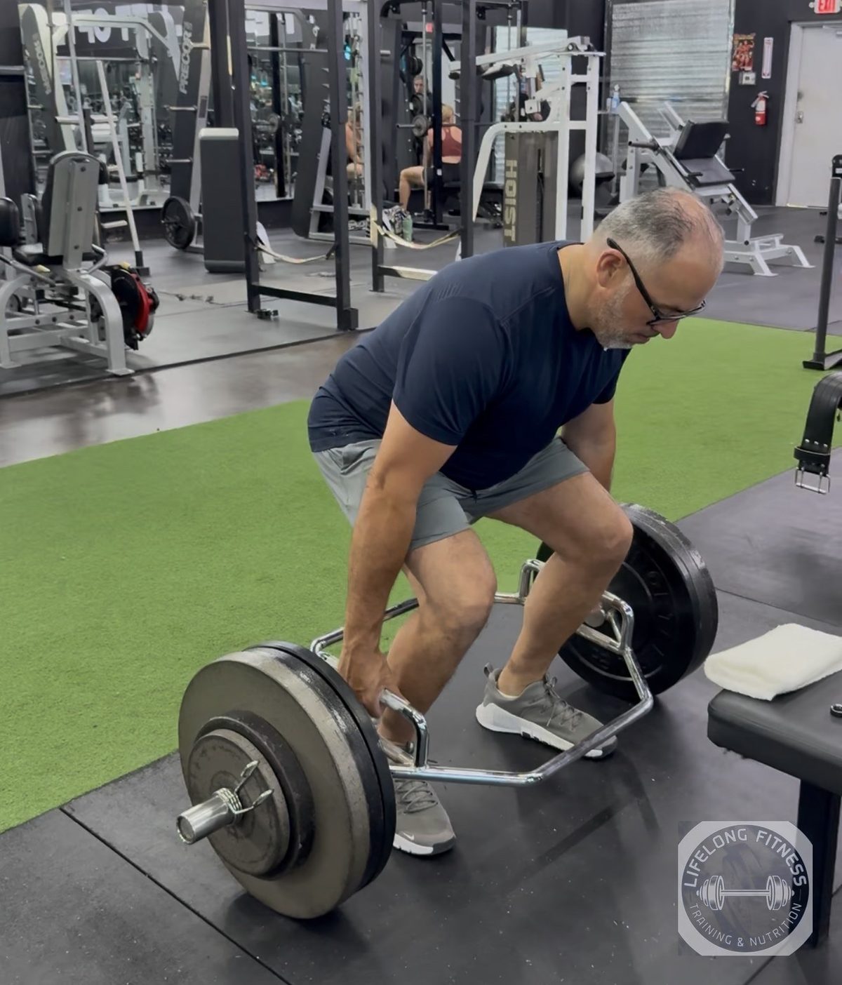 Client setting up for trap-bar deadlift at Rise Gym