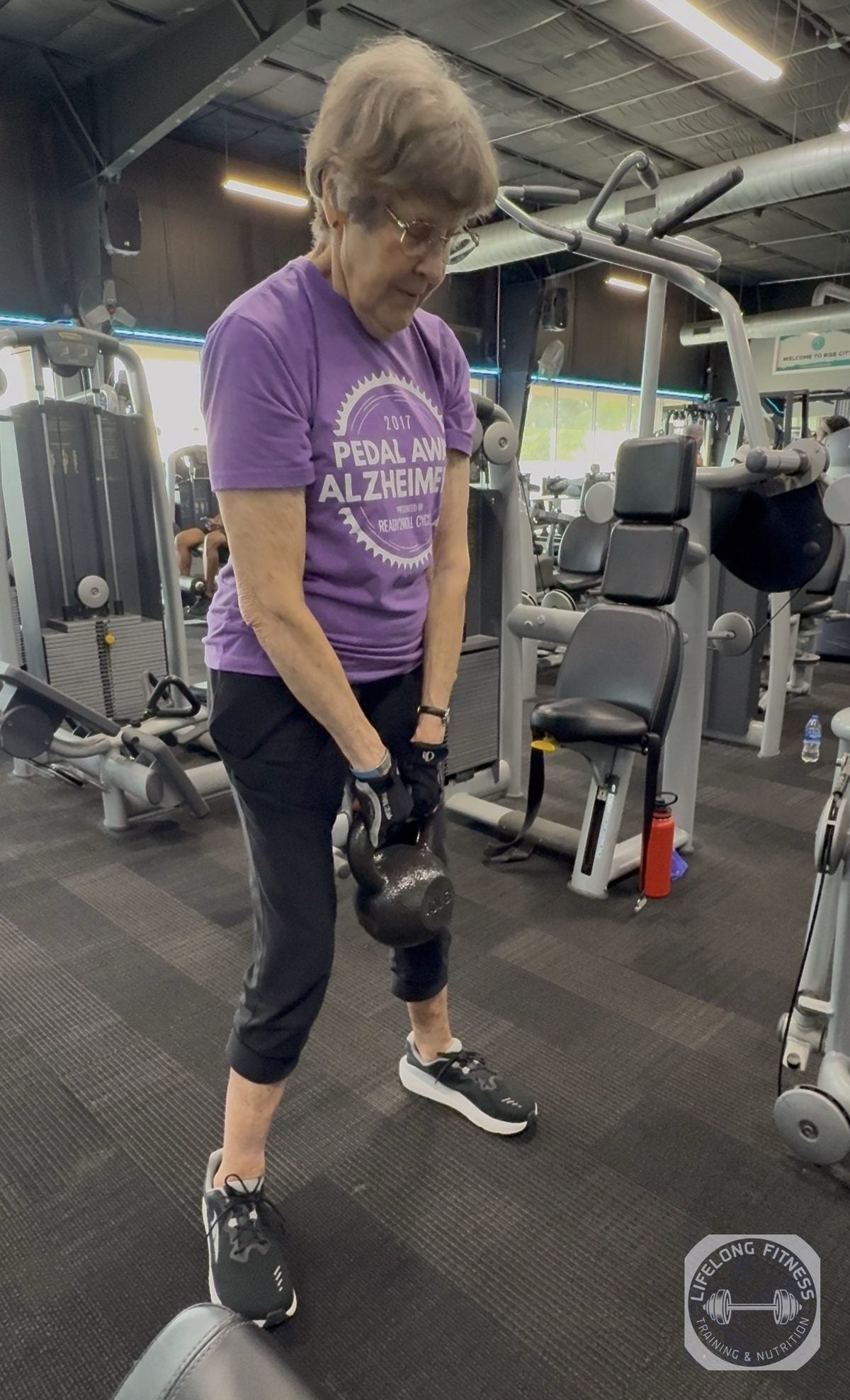 Client doing zercher squat at Rise Gym
