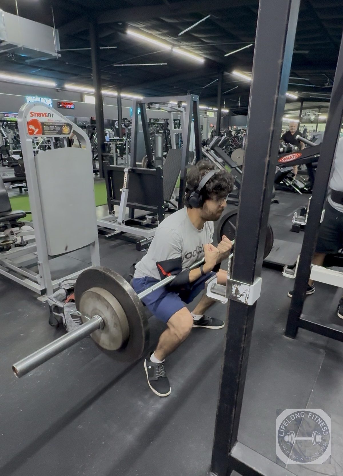 Older client training with kettlebell at Rise Gym